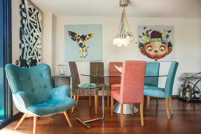 a dining room with chairs and a table at Luxury Apartment in Sitges City in Sitges