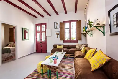 a living room with a couch and a table at Sweett - Raco in Barcelona