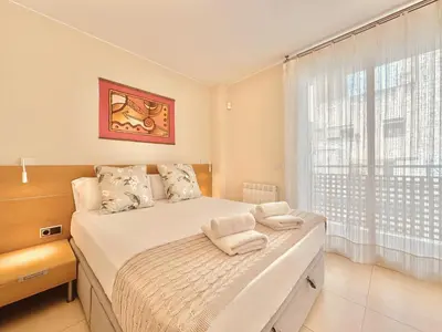 a bedroom with a bed and a large window at Casa Natura Barcelona Fira & Camp Nou Stadium in Hospitalet de Llobregat