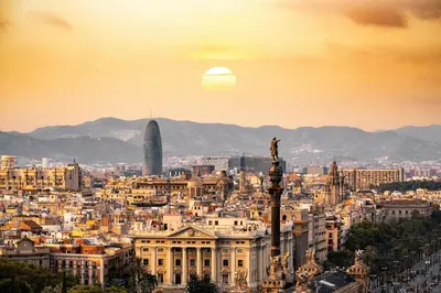 a view of a city with the sun setting at Casa Natura Barcelona Fira & Camp Nou Stadium in Hospitalet de Llobregat