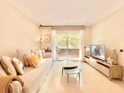 a living room with a couch and a table at Casa Natura Barcelona Fira & Camp Nou Stadium in Hospitalet de Llobregat