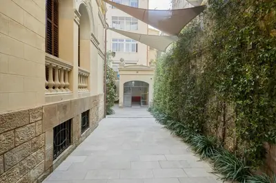 an alleyway between two buildings with a building at Le Palacete by Sweett in Barcelona