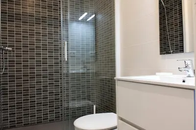 a bathroom with a shower with a toilet and a sink at Flateli Roger 6 in Barcelona