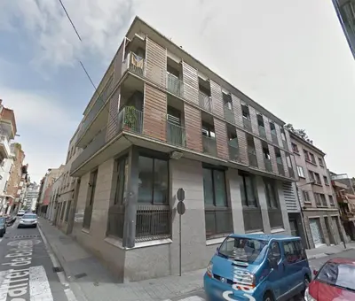 a blue van parked in front of a building at Apartment Barcelona Rentals - Park Güell Apartments in Barcelona