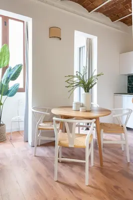 a dining room with a table and chairs at Diagonal Apartments by Olala Homes in Barcelona