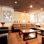 a living room with a couch and a coffee table at Hotel Granollers in Granollers