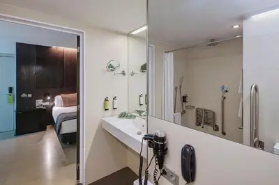 a bathroom with a sink and a mirror at Sercotel Hotel Rosellon in Barcelona