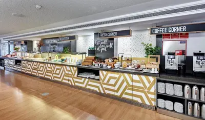 a store with a checkout counter in a store at Sercotel Hotel Rosellon in Barcelona