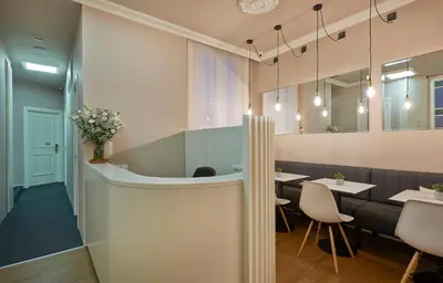 a restaurant with a table and chairs and a mirror at Hostal Central Barcelona in Barcelona
