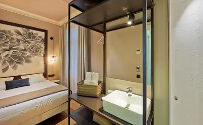 a hotel room with a bed and a sink at Hostal Central Barcelona in Barcelona