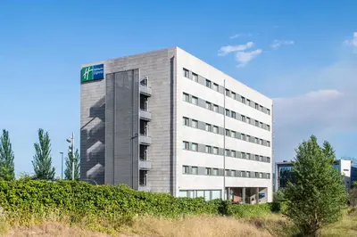 a building with a sign on the side of it at Holiday Inn Express Sant Cugat by IHG in Sant Cugat del Vallès