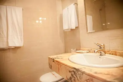 a bathroom with a sink and a toilet at Hostal Ramos in Barcelona