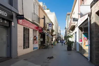 an empty street in a city with buildings at Hostal Solimar in Badalona