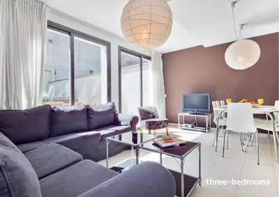 a living room with a couch and a table at Inside Barcelona Apartments Sants in Barcelona