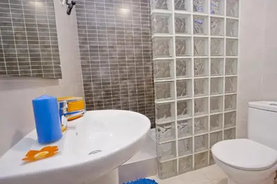 a bathroom with a sink and a toilet and a shower at Barcelona City Hotel in Barcelona