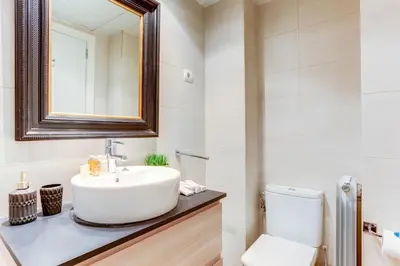 a bathroom with a sink and a toilet at Sweett - Raul in Barcelona