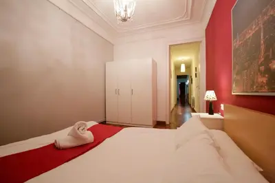 a bedroom with a bed with a towel on it at Charm Rambla Catalunya in Barcelona