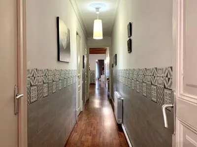 a hallway with tile on the walls and a hallway sidx sidx at Charm Rambla Catalunya in Barcelona