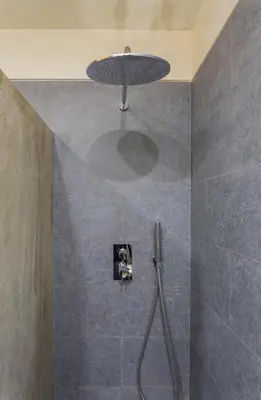 a bathroom with a shower with a shower head at Apartament Major 33 in Arbós