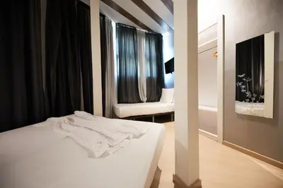 a white bed in a room with a window at Hostemplo Sagrada Familia in Barcelona