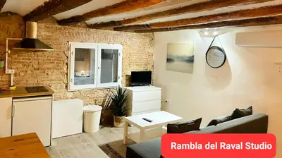a living room with a couch and a table at The Hipstel Parallel in Barcelona