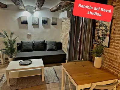 a living room with a couch and a table at The Hipstel Parallel in Barcelona