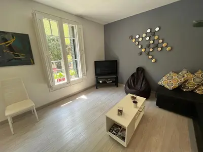 a living room with a couch and a table at Barcelona 54 Apartment Rentals in Barcelona