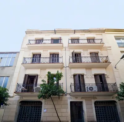 a building with balconies on the side of it at Centric Gracia Apartments in Barcelona