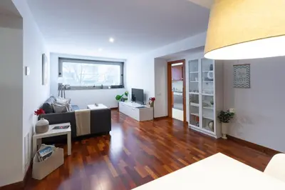 a living room with a couch and a table at Barcelona - Camp Nou in Hospitalet de Llobregat