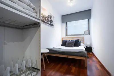a bedroom with a bed and a window at Barcelona - Camp Nou in Hospitalet de Llobregat