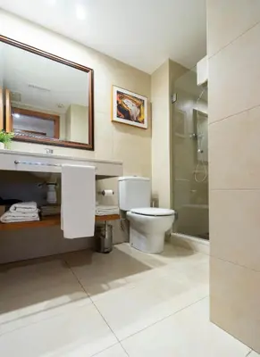 a bathroom with a toilet and a sink and a shower at Barcelona - Camp Nou in Hospitalet de Llobregat
