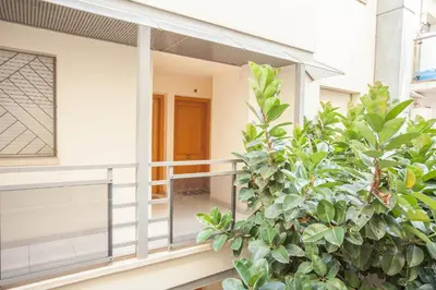 a balcony of a house with a plant at Sitges Center & Beach Espalter in Sitges