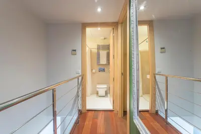 a hallway leading to a bathroom with a toilet at Apartment Barcelona Rentals - Swimming Pool with Terrace in Barcelona