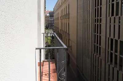 a view from a balcony of a building at Hostal Operaramblas in Barcelona