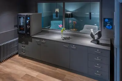 a bathroom with a sink and a microwave at Hostal Operaramblas in Barcelona