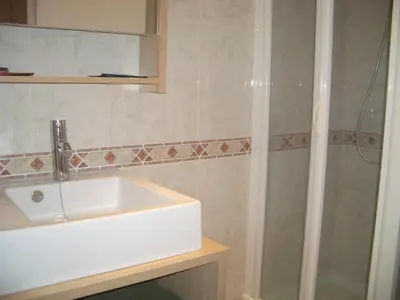 a bathroom with a sink and a shower at Sitges Beach Panorama in Sitges