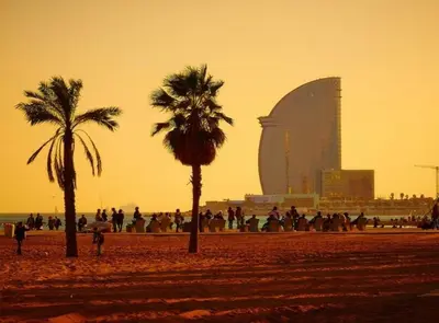 a group of people on a beach with palm trees at City&Beach Apartments in City Center in Barcelona