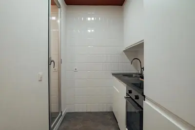 a small bathroom with a sink and a shower at Design Apartments by Olala Homes in Hospitalet de Llobregat