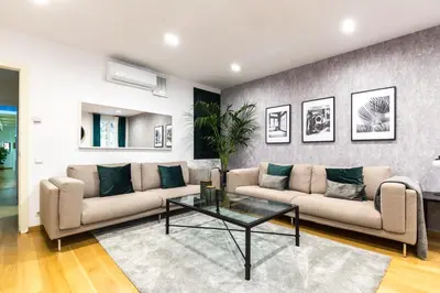 a living room with two couches and a table at Sarriá - Sant Gervasi in Barcelona