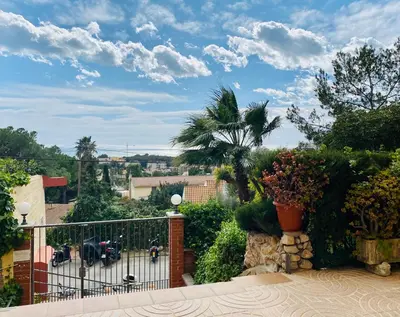 a balcony with a view of a city at Panoramic Apartments Sitges in Sitges