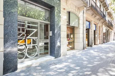 a street with a store window on a building at Habitat Apartments Garden View in Barcelona
