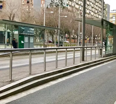 a bus stop on the side of a city street at Nova Mar Bella Apartment in Barcelona