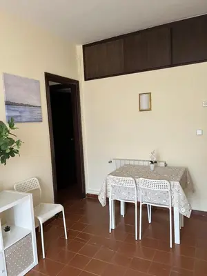 a dining room with a table and two chairs at Camp Nou Apartment WiFi in Barcelona