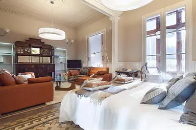a large bedroom with a large bed with pillows on it at Apartment Barcelona Rentals - Rambla de Catalunya Center in Barcelona