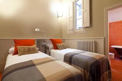 two beds sitting next to each other in a room at Apartment Barcelona Rentals - Rambla de Catalunya Center in Barcelona