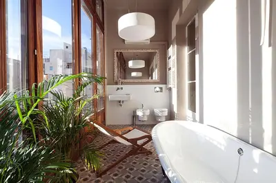 a bathroom with a bath tub and two toilets at Apartment Barcelona Rentals - Rambla de Catalunya Center in Barcelona