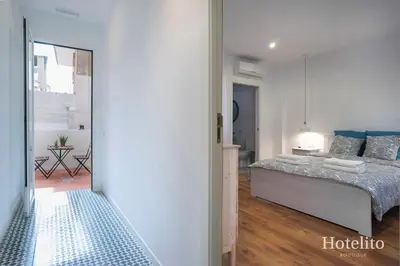 a bedroom with a large bed in a room at Hotelito Boutique Camp Nou in Hospitalet de Llobregat