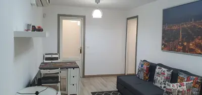 a living room with a couch and a table at APARTAMENTS B O D CoLLBLANC in Hospitalet de Llobregat