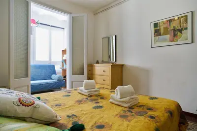 a bedroom with a bed with towels on it at My Home in Barcelona in Barcelona