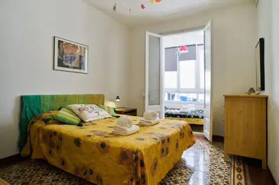 a bedroom with a bed with towels on it at My Home in Barcelona in Barcelona